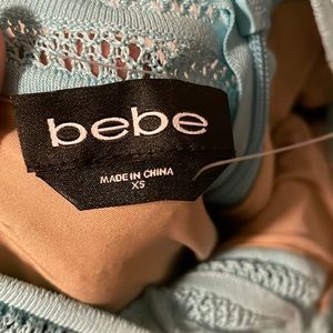 Beautiful bebe mini dress, turquoise color, shapes your body nice